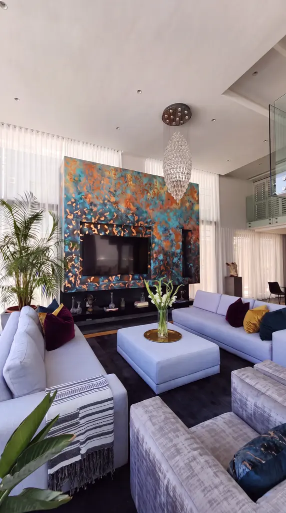 Reconstruction from a photograph: a living-room wall in Bantry Bay goes from plain plaster to Linda Wolf’s teal and copper.