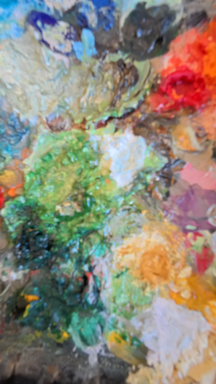 Linda\u2019s palette up close: thick oil colour in greens, blues, coral, white and gold.